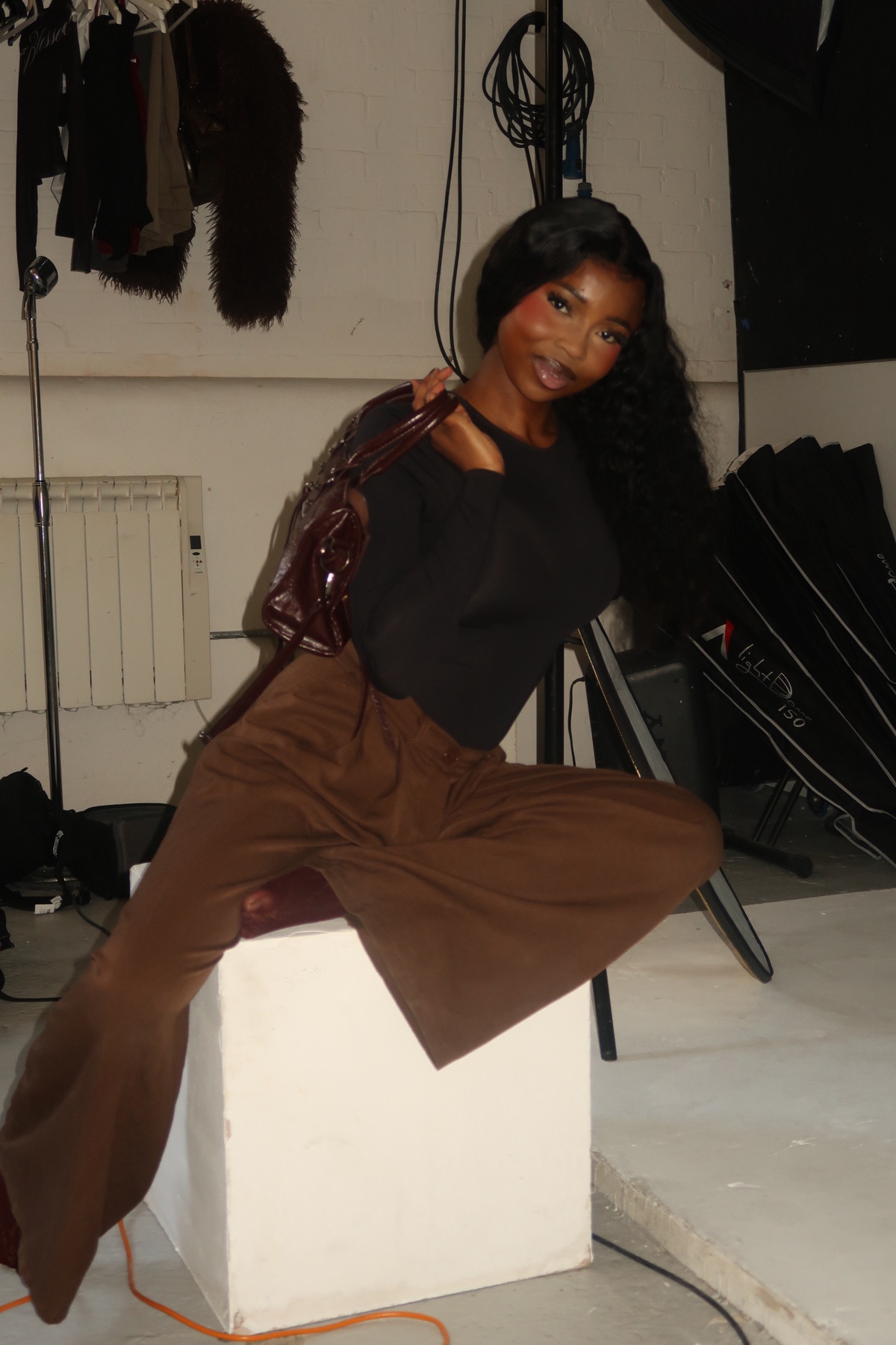 Studio fashion portrait in warm neutral tones